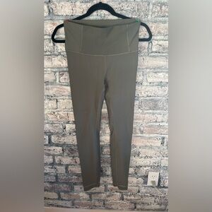 Lululemon Olive Green Leggings with unique reflective dots at bottom excel cond.